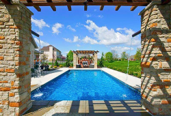 Rectangle with vinyl corner step entry, a pergola on either end of the pool and dramatic water feature in the deep end